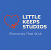 Logo of Little Keeps Studios with a heart and scissors on a blue background